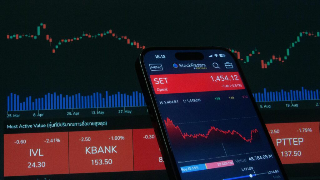 pexels photo 28682358 28682358 Mobile app showing stock market data with charts on screen.